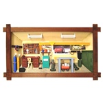 Poland has a long history of craftsmen working with wood in southern Poland. Their workshops produce beautiful hand made boxes, plates and carvings.  This shadow box is a look inside a traditional Polish vehicle repair shop.  Note the nice attention to de