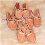 These miniature versions are made of pigskin, come with plastic soles and are sized in centimeters.