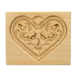 Solid beech wood hand carved mold featuring a traditional heart shape folk design.  This mold comes from the gingerbread museum in Torun, Poland.  These types of wooden molds are used to create gingerbread and cookie designs.
