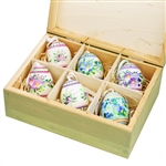 Hand painted duck eggs featuring Polish floral patterns and nested inside a hand painted wooden box. The duck eggs are blown out and come with a ribbon hanger. Eggs are all hand painted and decorations will vary from set to set.